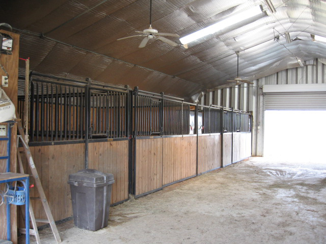 Alpine interior with horse stalls