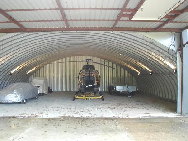 Arch building for helicopter storage