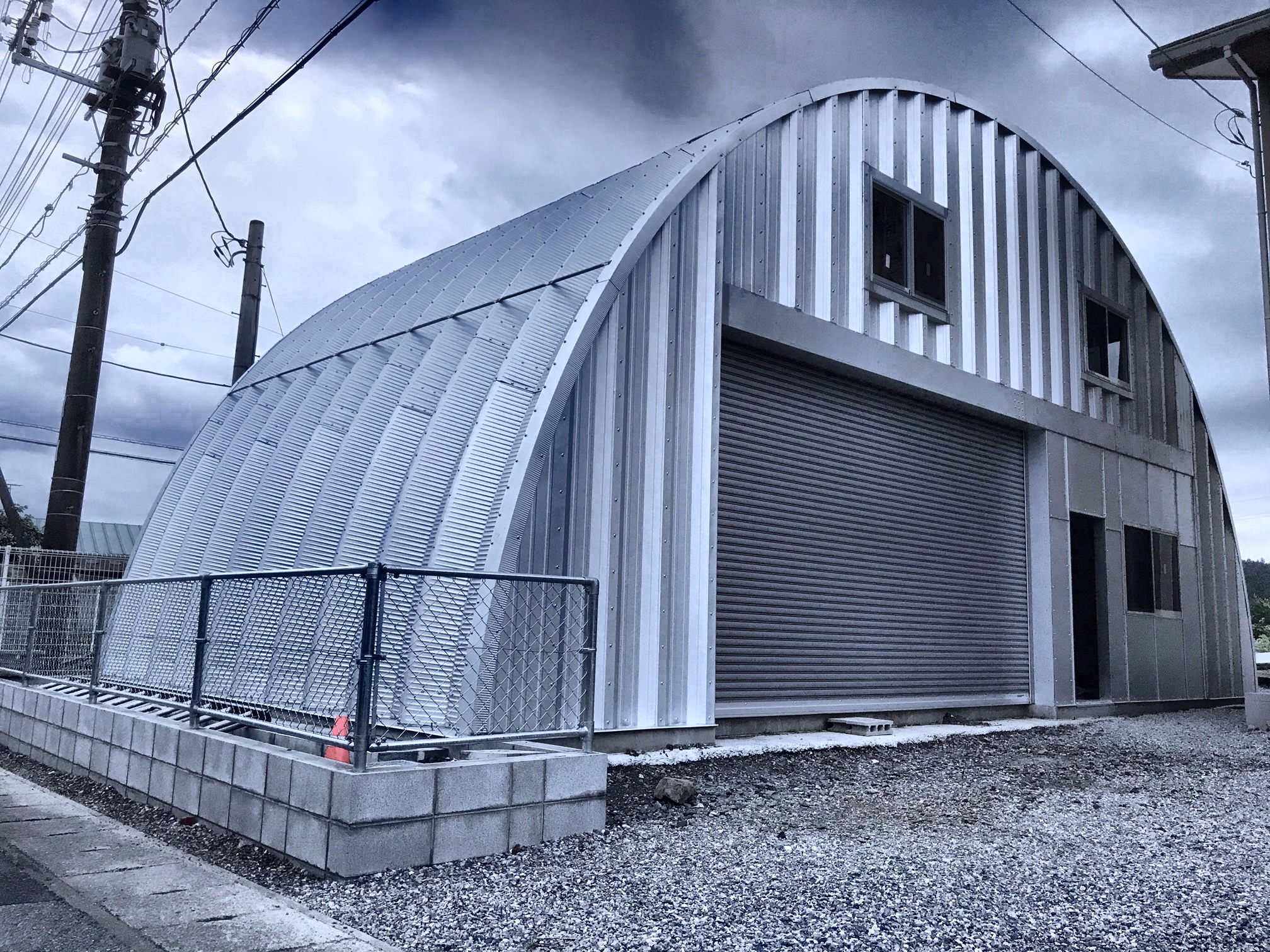 Arch building with storage and offices