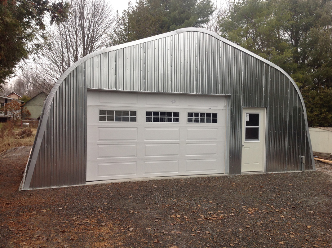 Alpine garage with overhead door and man door