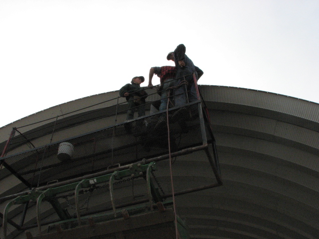 Elevated arch building construction men on scaffolding