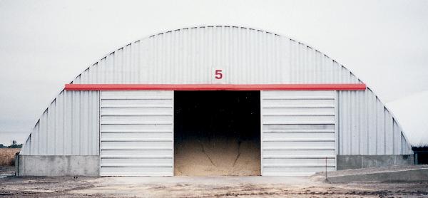 Arch building with sliding doors for grain storage