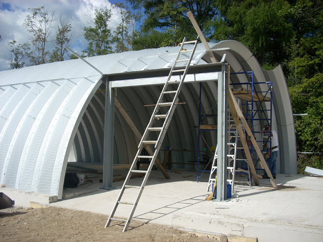 Arch building construction with side entrance