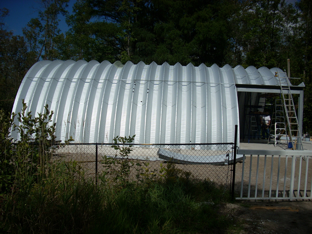 Arch building construction with side entrance