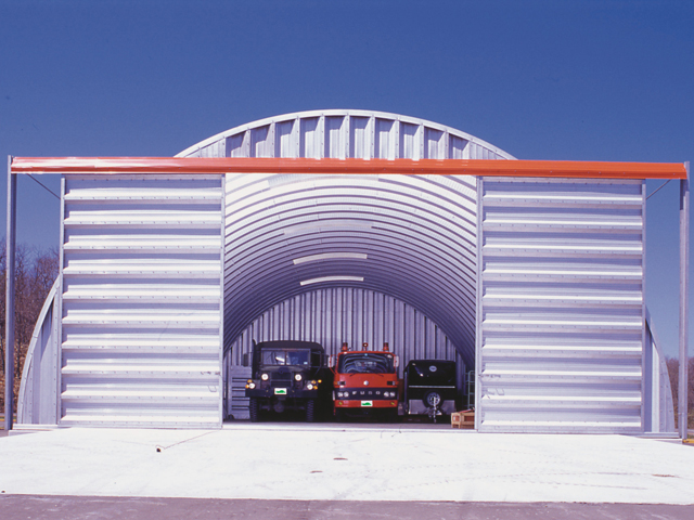 Large Arch building garage with sliding doors